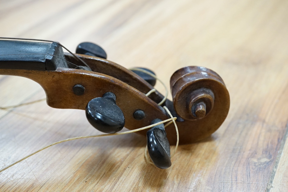 A quarter-size German violin, back measures 31cm. Condition - fair